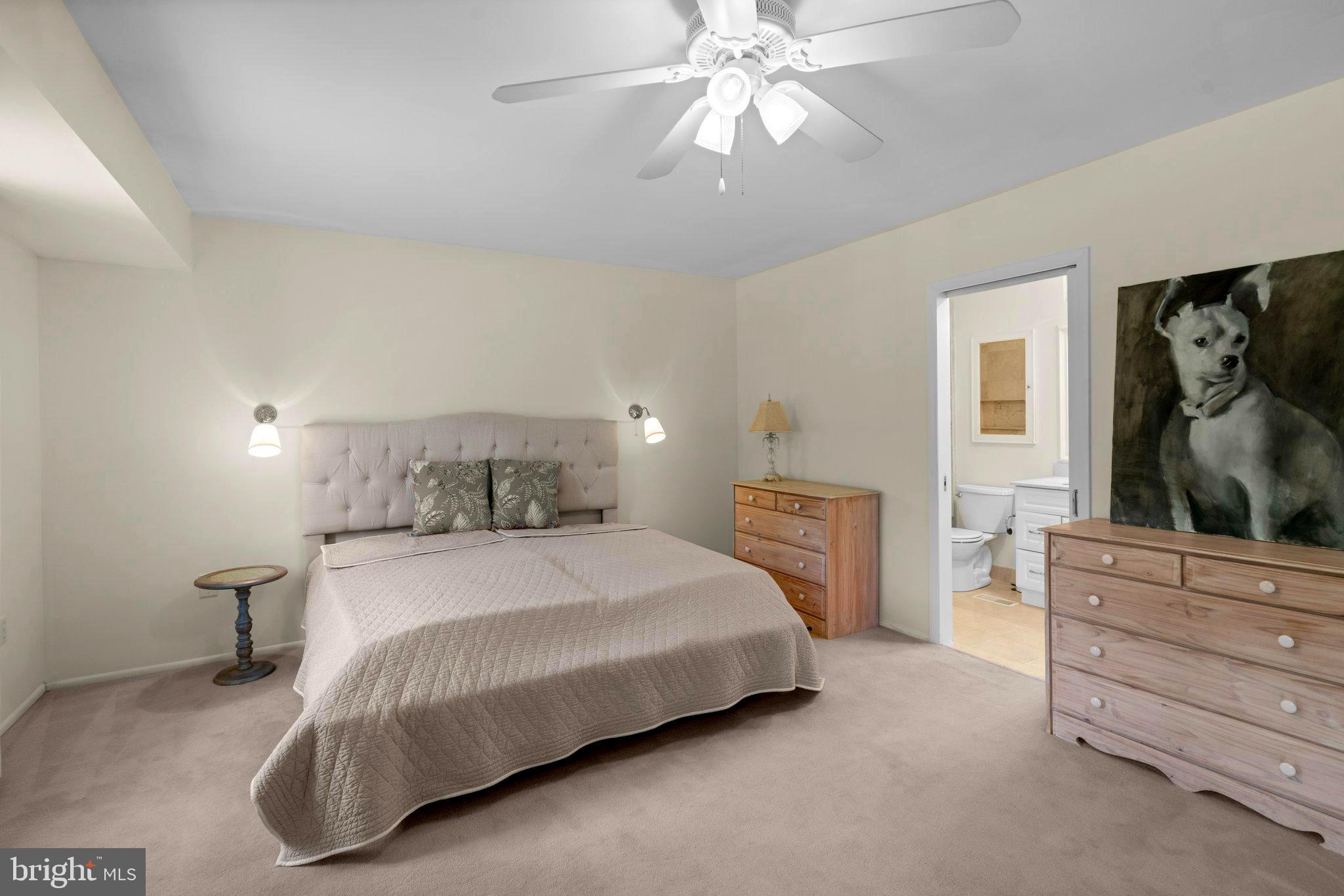 2 Stone Ridge Court Baltimore, MD 21239 - Photo 28 of 45 a bedroom with a bed and a dresser