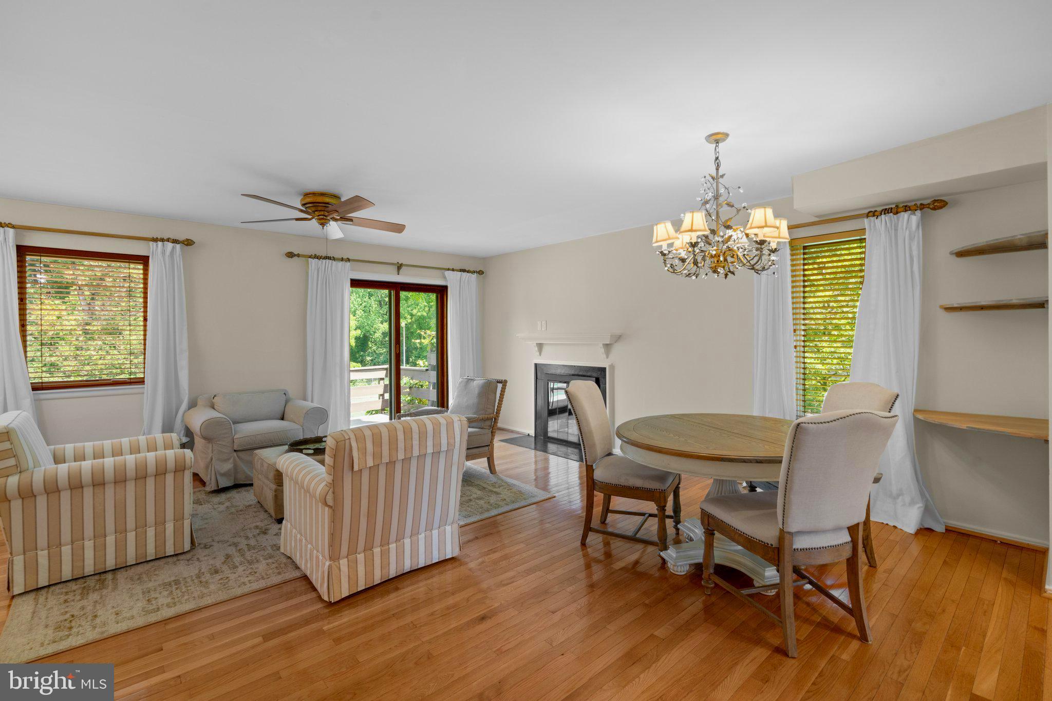 2 Stone Ridge Court Baltimore, MD 21239 - Photo 10 of 45 a view of a dining room with furniture a chandelier and wooden floor