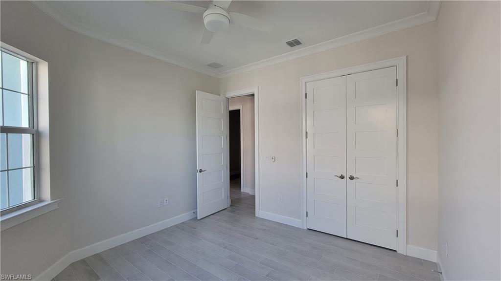 6378 Negril Isle Drive Naples, FL 34113 - Photo 11 of 15 a view of an empty room with a window