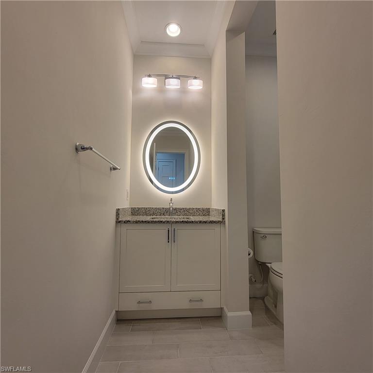 6378 Negril Isle Drive Naples, FL 34113 - Photo 12 of 15 a bathroom with a sink and a mirror