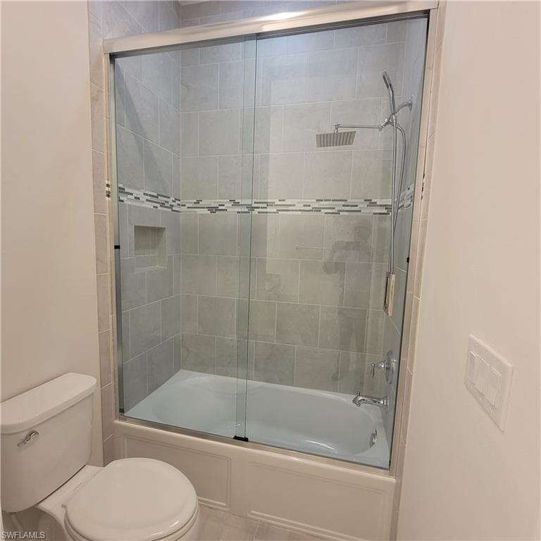 6378 Negril Isle Drive Naples, FL 34113 - Photo 13 of 15 a bathroom with a shower and a toilet