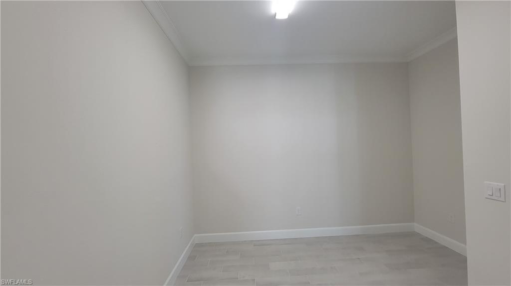 6378 Negril Isle Drive Naples, FL 34113 - Photo 14 of 15 a view of an empty room