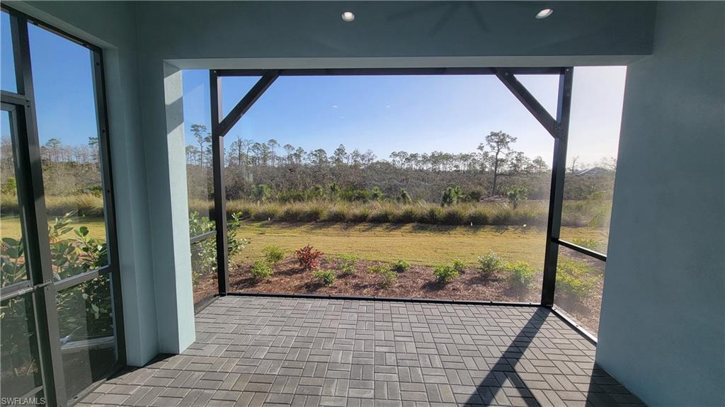 6378 Negril Isle Drive Naples, FL 34113 - Photo 3 of 15 a view of a balcony from a window