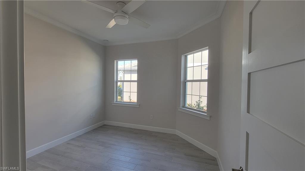 6378 Negril Isle Drive Naples, FL 34113 - Photo 10 of 15 an empty room with windows and closet