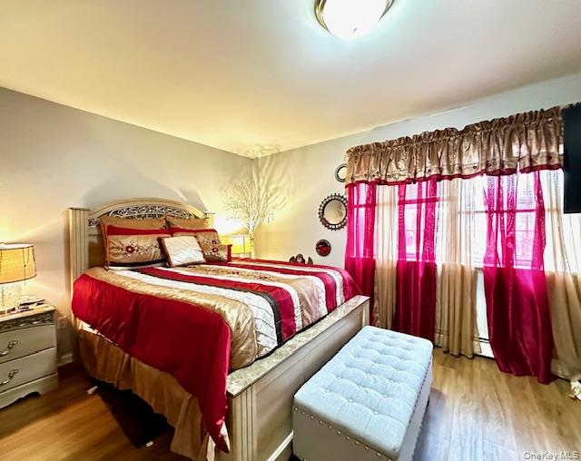 24 Partition Street Haverstraw, NY 10927 - Photo 7 of 8 a bedroom with a bed and a large mirror