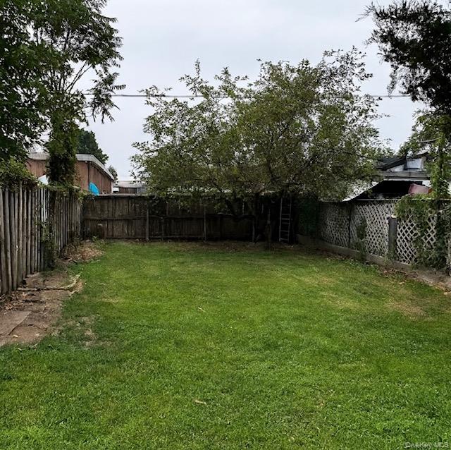 24 Partition Street Haverstraw, NY 10927 - Photo 8 of 8 a view of a backyard with a plants and trees