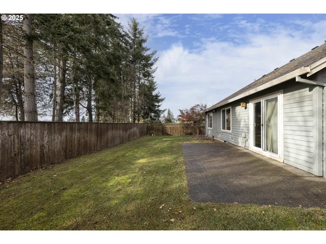 a backyard of a house with lots of green space
