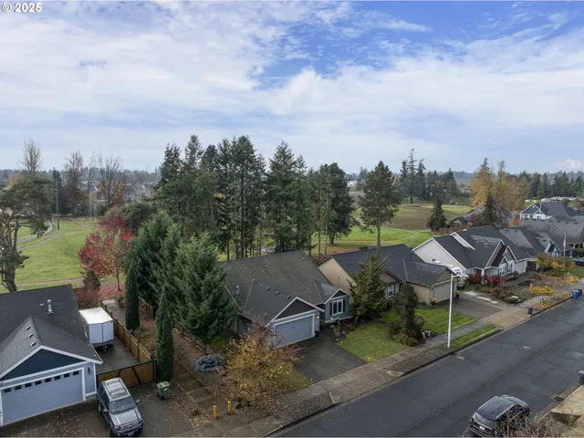 an aerial view of a house with outdoor space