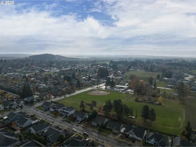 an aerial view of residential house with outdoor space