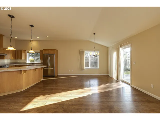 a view of a kitchen with kitchen appliances
