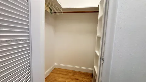 a view of an empty walk in closet