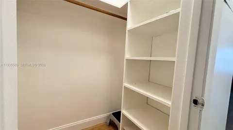 a view of a backyard with a garden and plants