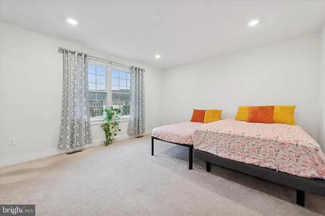 a bedroom with a bed and a walk in closet