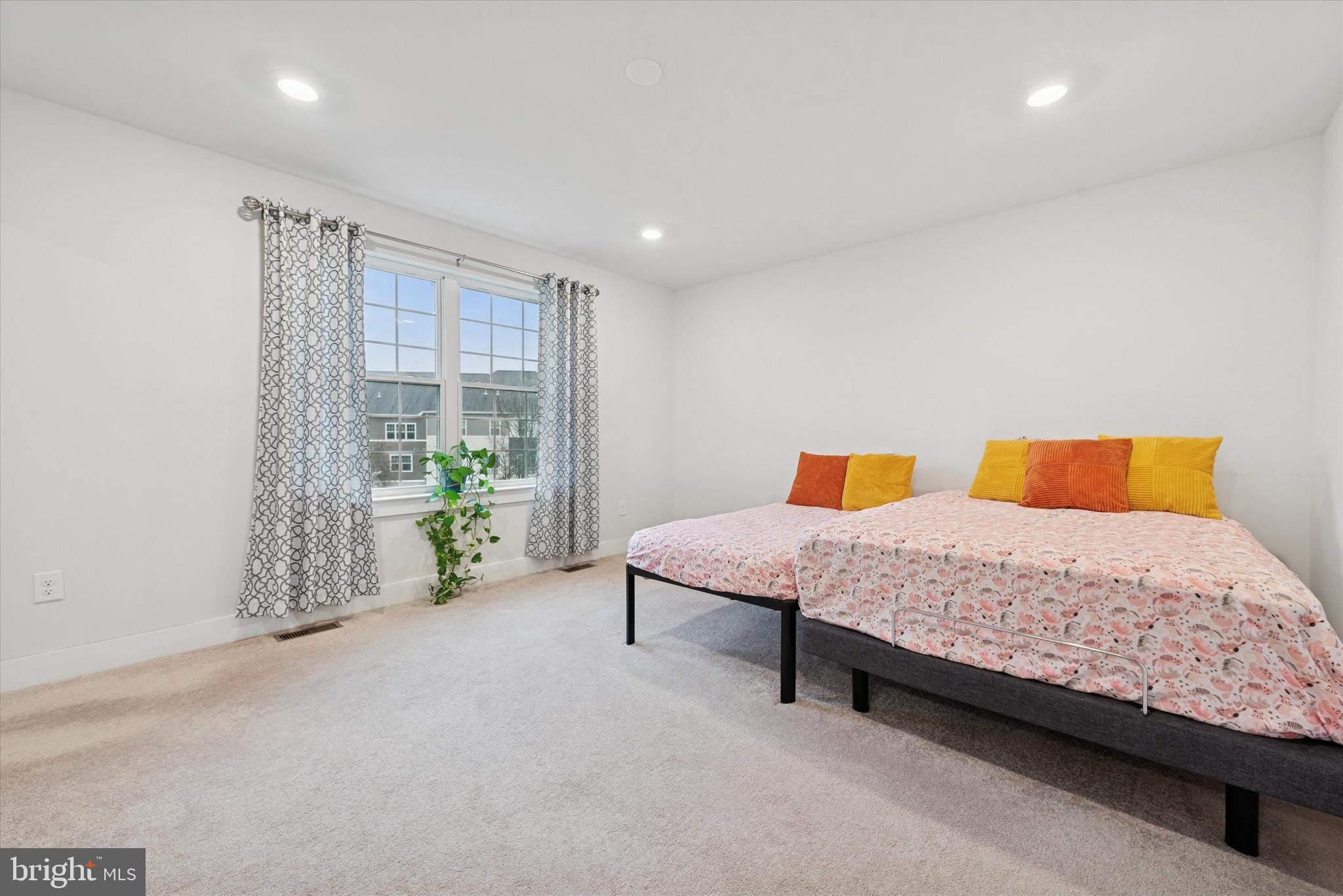 235 Red Leaf Lane Exton, PA 19341 - Photo 12 of 25 a bedroom with a bed and a walk in closet