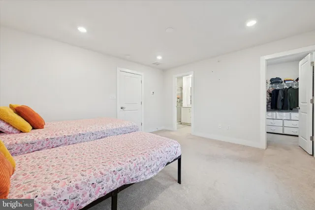 a bedroom with a bed and dresser