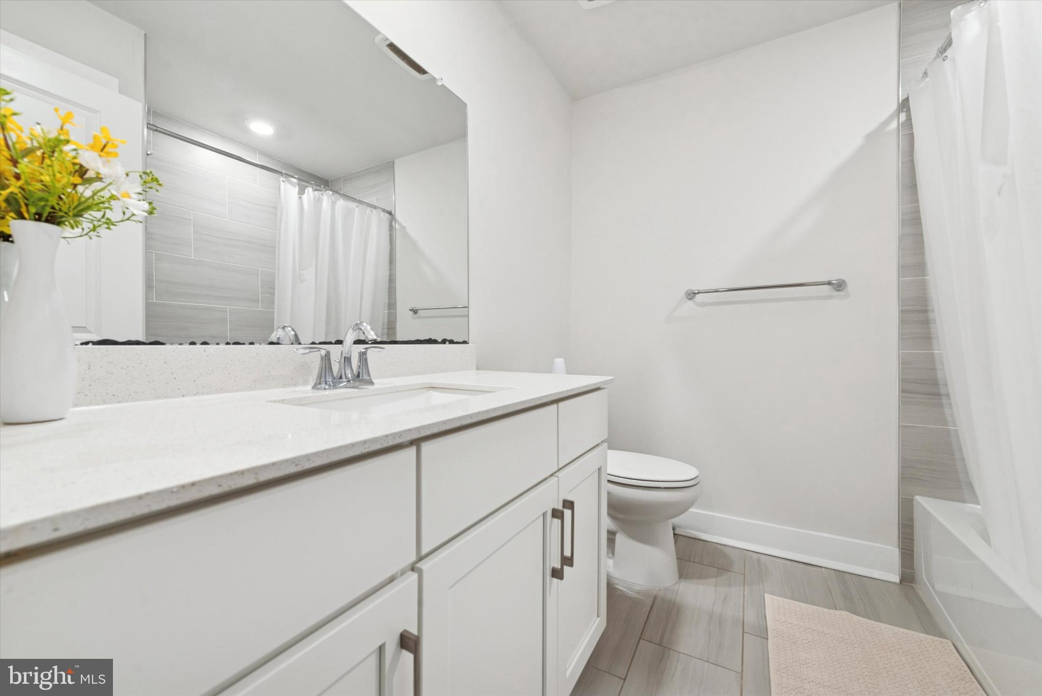 235 Red Leaf Lane Exton, PA 19341 - Photo 16 of 25 a bathroom with a sink a toilet and a mirror