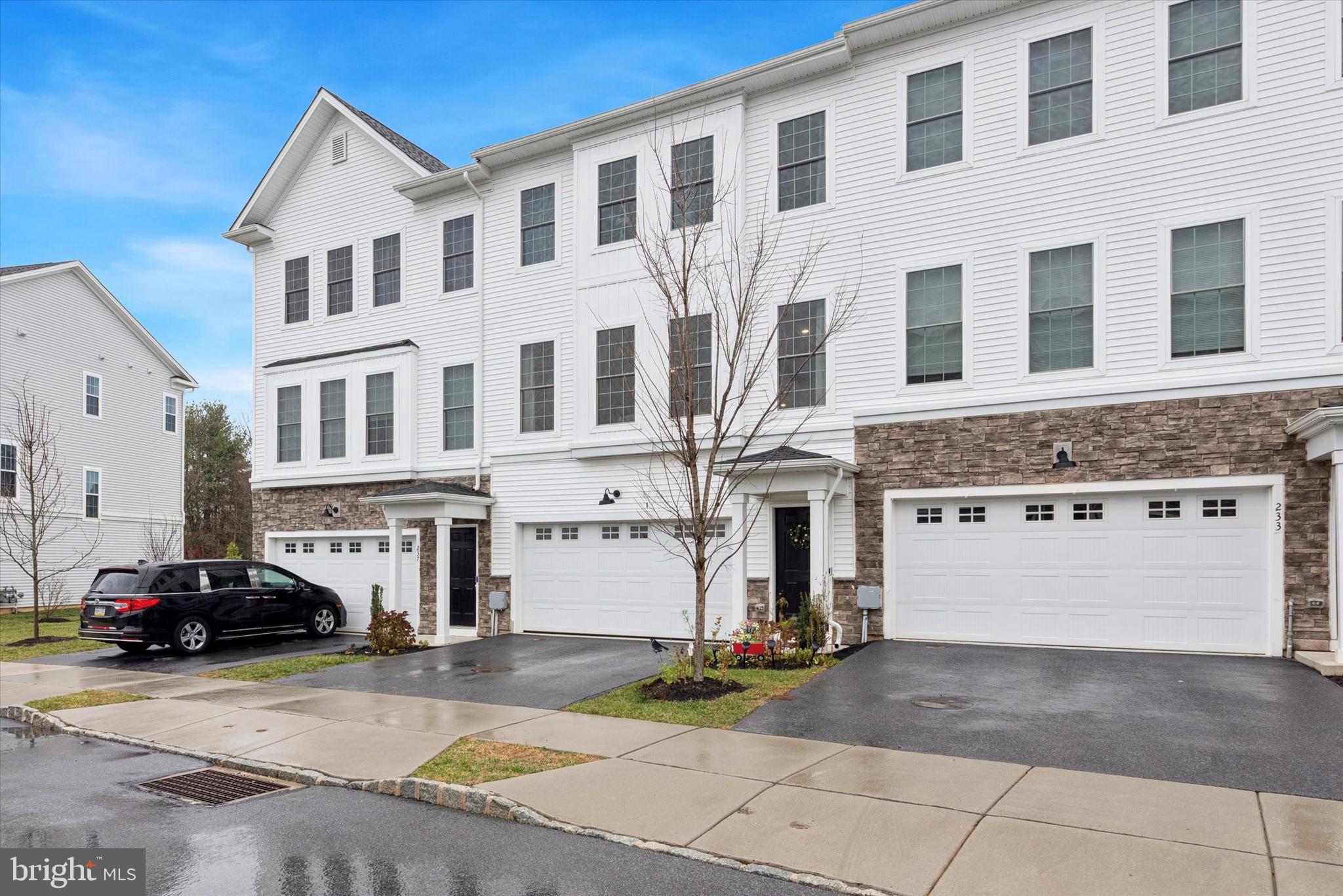235 Red Leaf Lane Exton, PA 19341 - Photo 2 of 25 a view of a building with car parked on the road