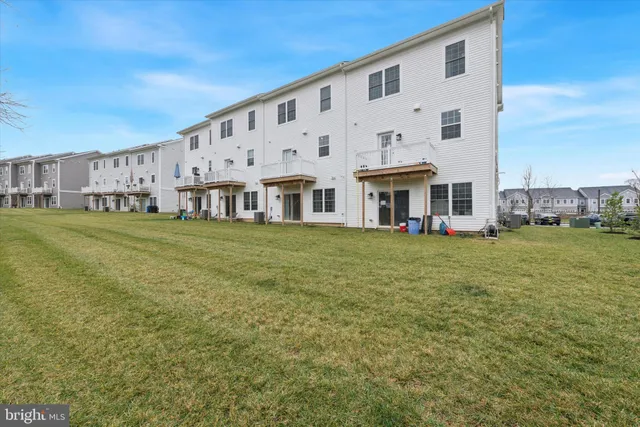 a front view of building with yard