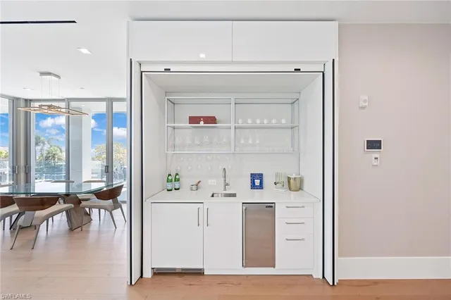 a bedroom with a large bed and a large window