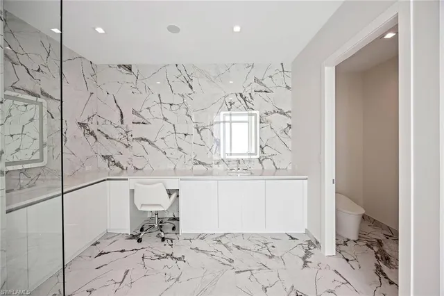 a room with a bed and a night stand