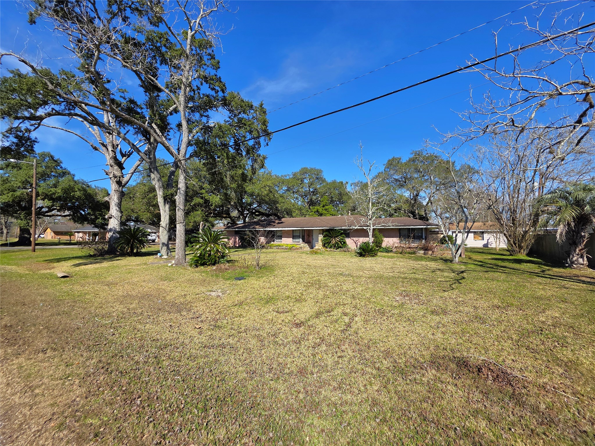 706 Maple Street Sweeny, TX 77480 - Photo 2 of 42 a front view of a house with a yard