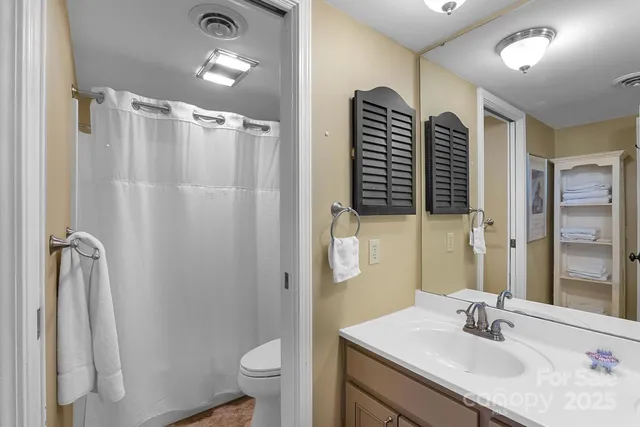 a bedroom with a bed and a mirror