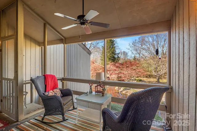 a backyard of a house with a yard and outdoor seating