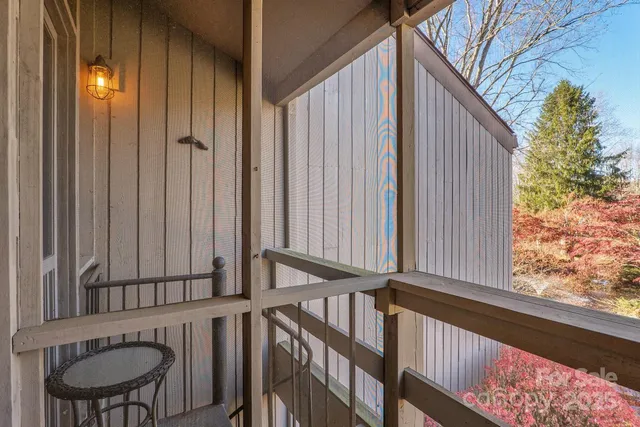 a view of a yard with yellow house