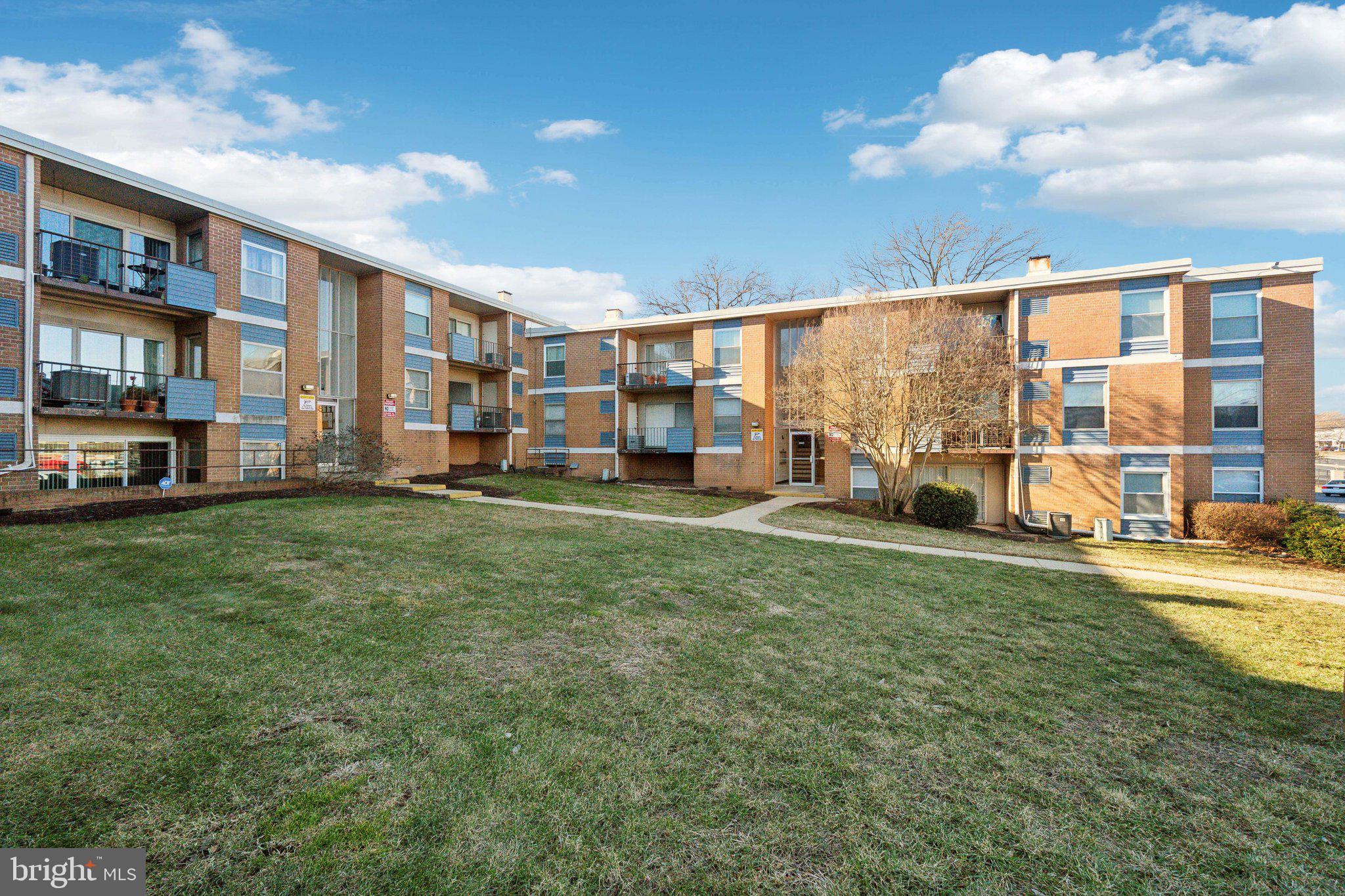 3809 St Barnabas Road, Unit T202 Suitland, MD 20746 - Photo 20 of 20 a view of a house with a big yard and large trees