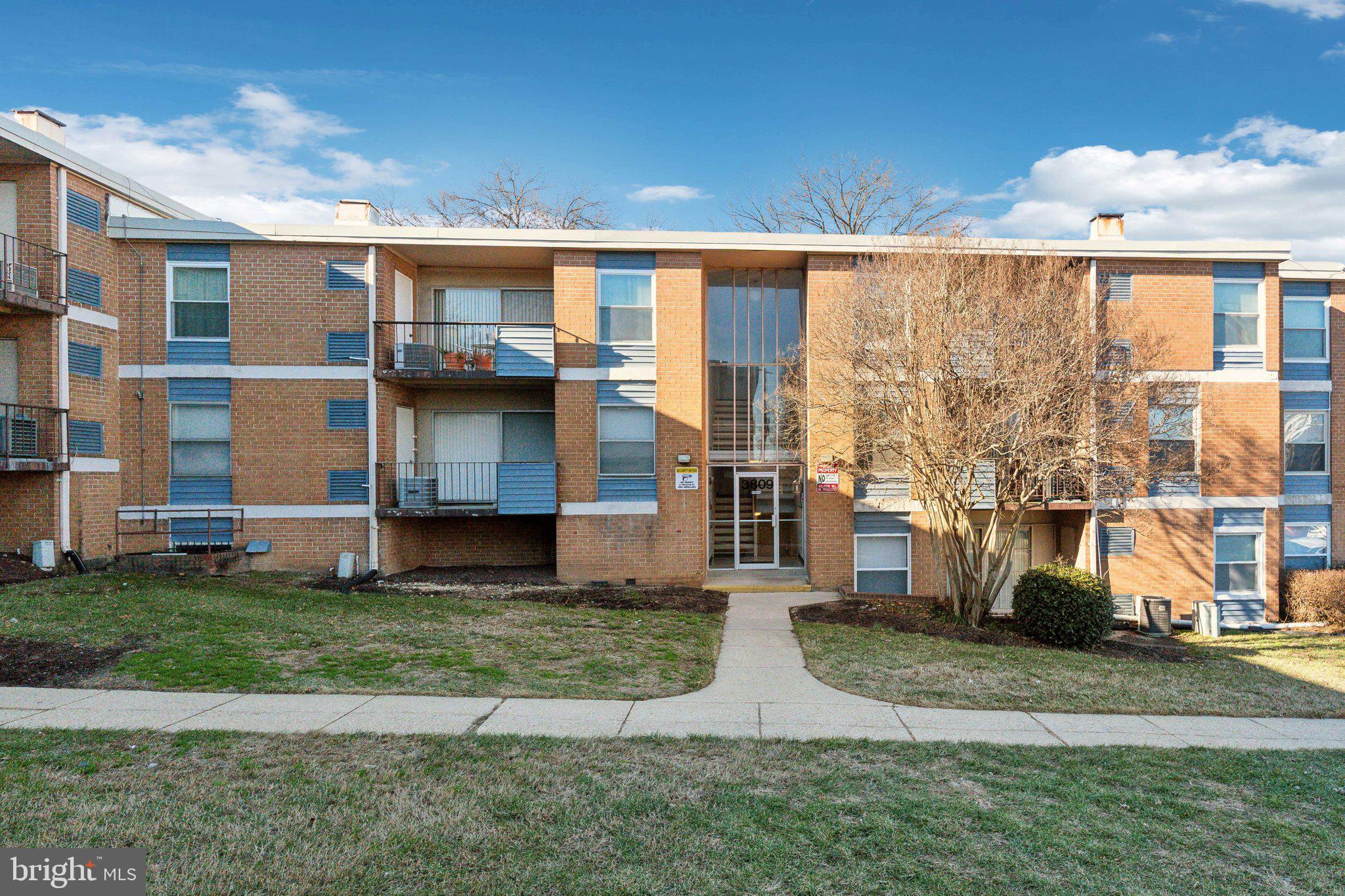 3809 St Barnabas Road, Unit T202 Suitland, MD 20746 - Photo 2 of 20 a view of a house with a yard