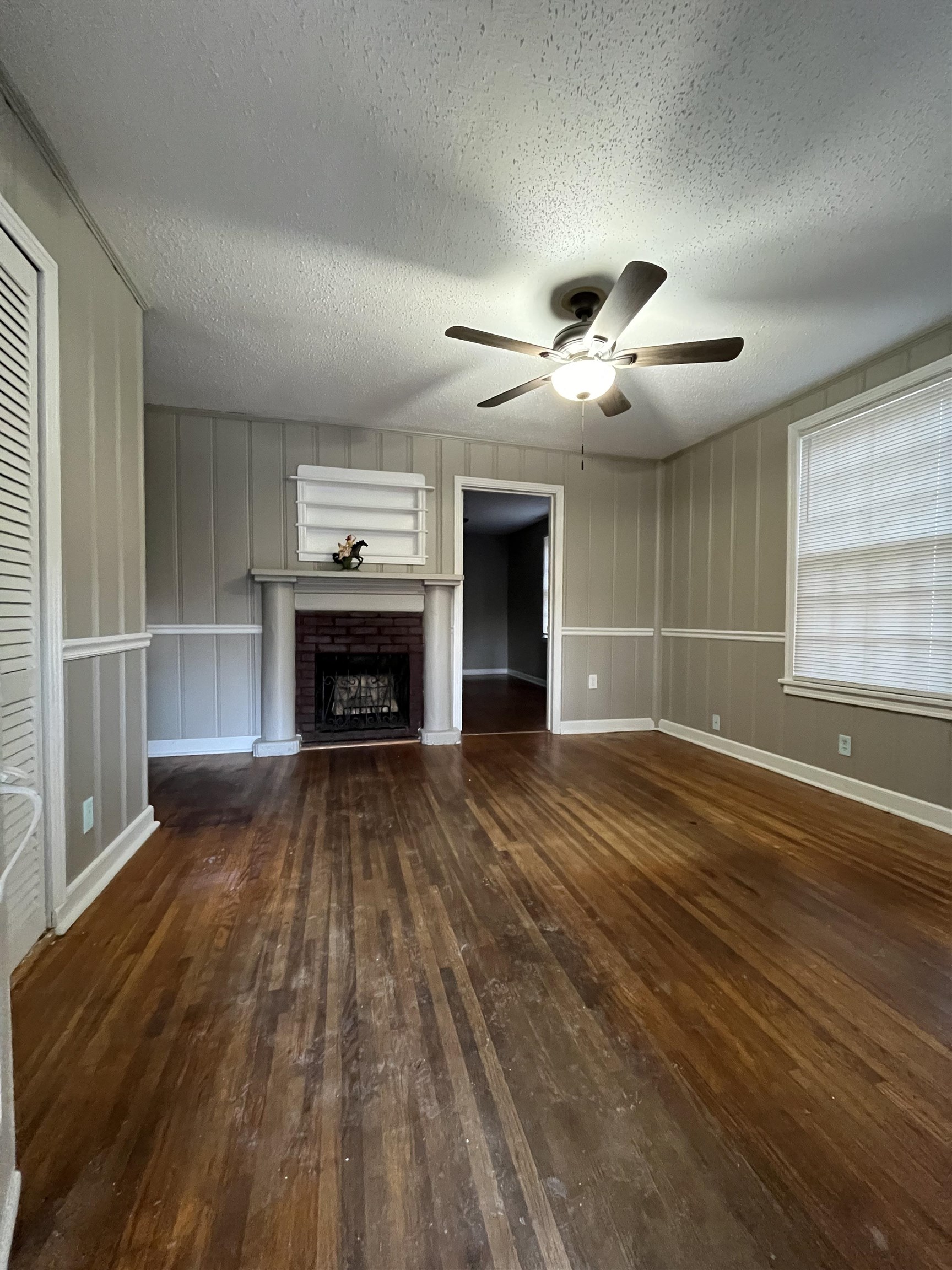 4297 Prescott Road Memphis, TN 38118 - Photo 14 of 14 a view of empty room with wooden floor and fireplace