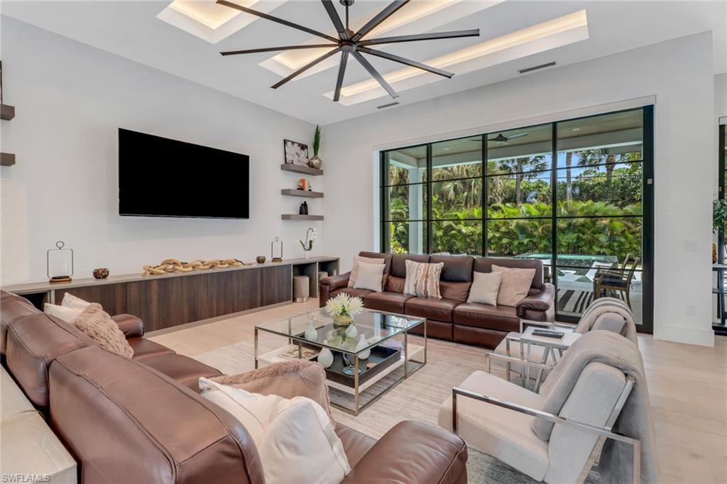 1546 Mandarin Road Naples, FL 34102 - Photo 11 of 48 Living room featuring light wood-type flooring