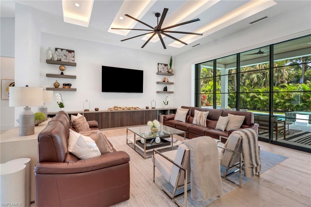 1546 Mandarin Road Naples, FL 34102 - Photo 12 of 48 Living room with light hardwood / wood-style flooring and ceiling fan
