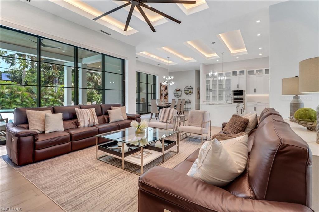 1546 Mandarin Road Naples, FL 34102 - Photo 13 of 48 Living room with light hardwood / wood-style floors and an inviting chandelier