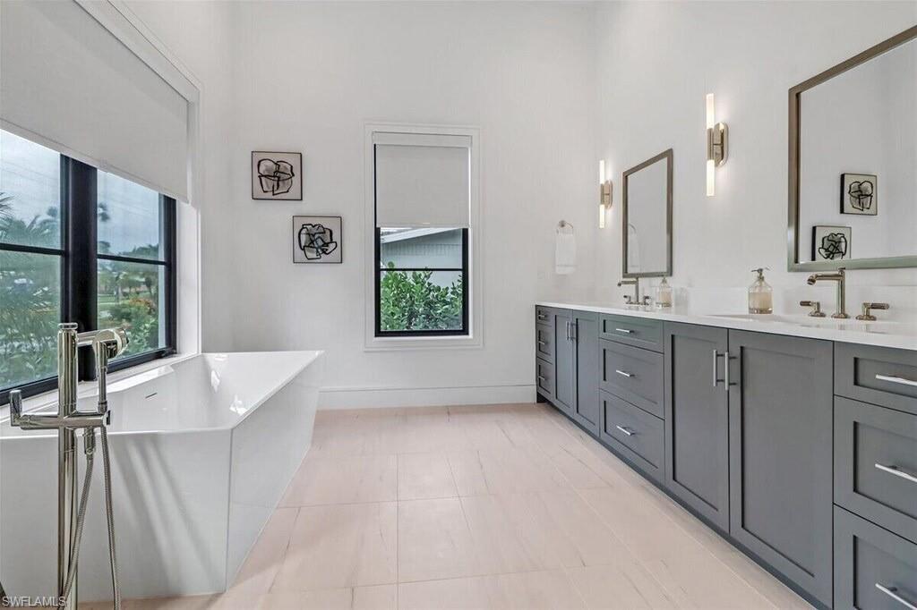 1546 Mandarin Road Naples, FL 34102 - Photo 20 of 48 Bathroom with a bathtub, tile patterned flooring, and vanity