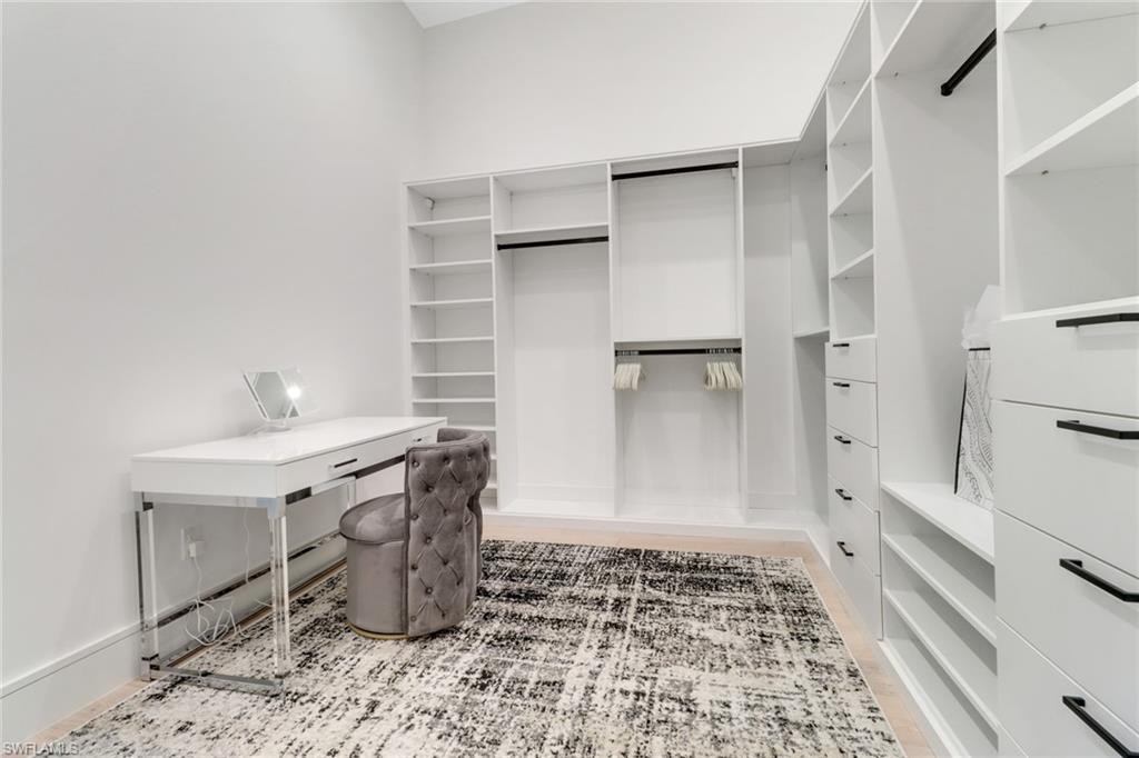 1546 Mandarin Road Naples, FL 34102 - Photo 23 of 48 Spacious closet featuring wood-type flooring