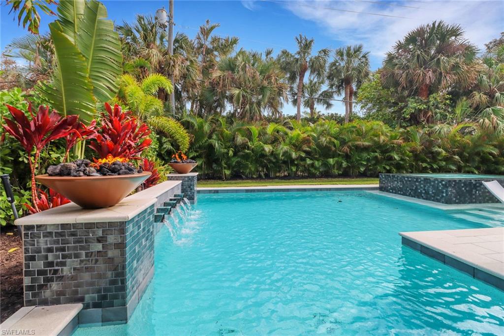 1546 Mandarin Road Naples, FL 34102 - Photo 34 of 48 View of swimming pool with pool water feature