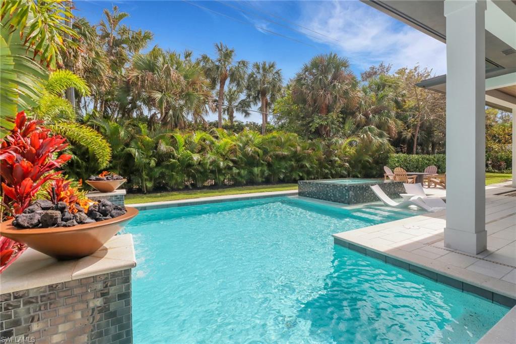1546 Mandarin Road Naples, FL 34102 - Photo 35 of 48 View of pool featuring an in ground hot tub
