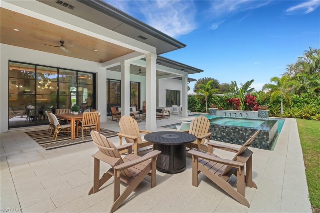 1546 Mandarin Road Naples, FL 34102 - Photo 41 of 48 View of patio / terrace with an in ground hot tub and ceiling fan