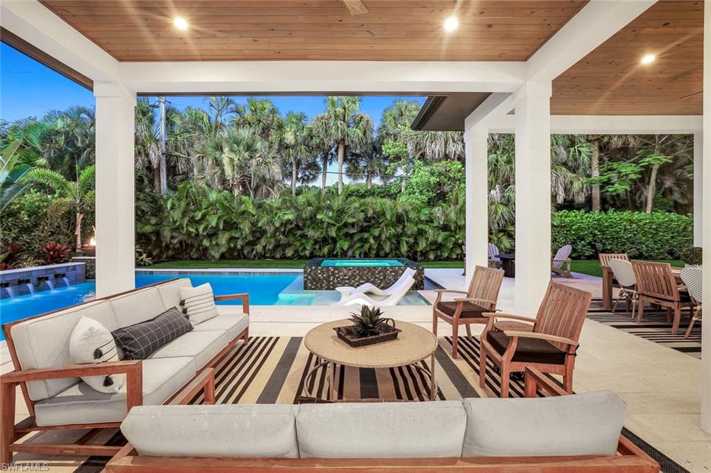 1546 Mandarin Road Naples, FL 34102 - Photo 44 of 48 Swimming pool featuring a patio and outdoor lounge area