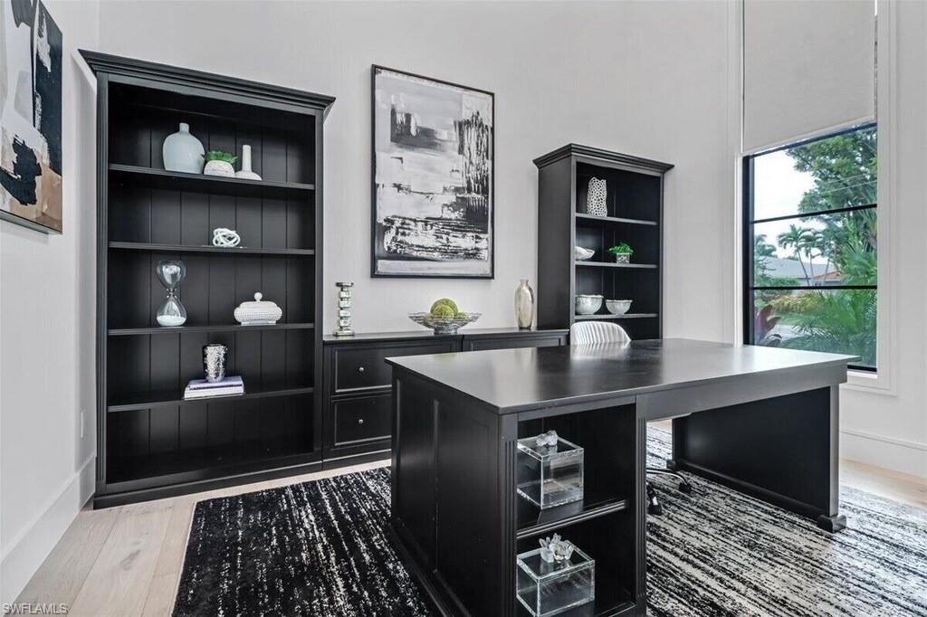 1546 Mandarin Road Naples, FL 34102 - Photo 9 of 48 Office area with wood-type flooring and built in shelves