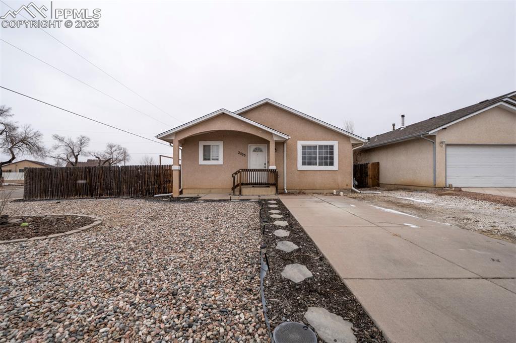2503 Lowell Avenue Pueblo, CO 81003 - Photo 1 of 25 a front view of a house with a yard