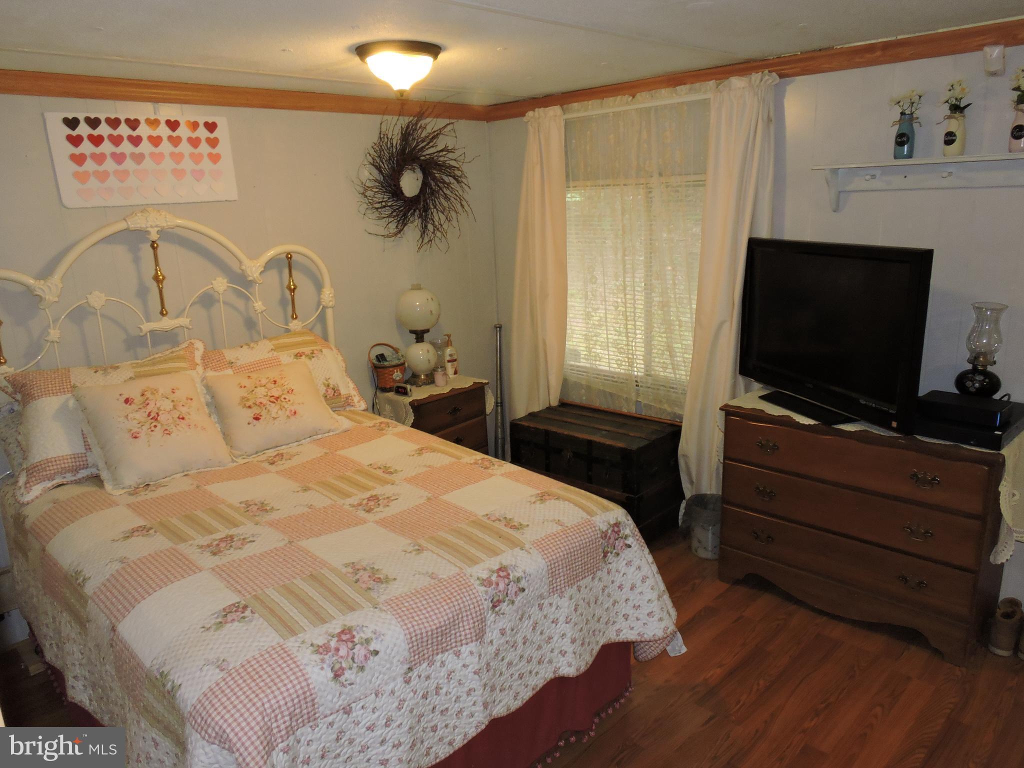 59 Cool Hollow Road Falling Waters, WV 25419 - Photo 15 of 20 King bed and more. Private bath has f