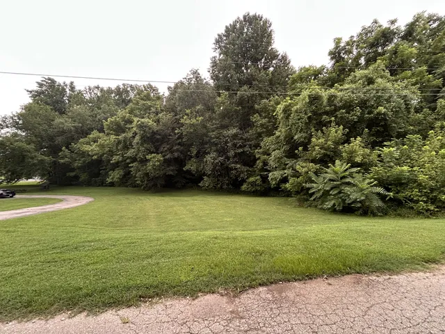 a view of a golf course with a trees