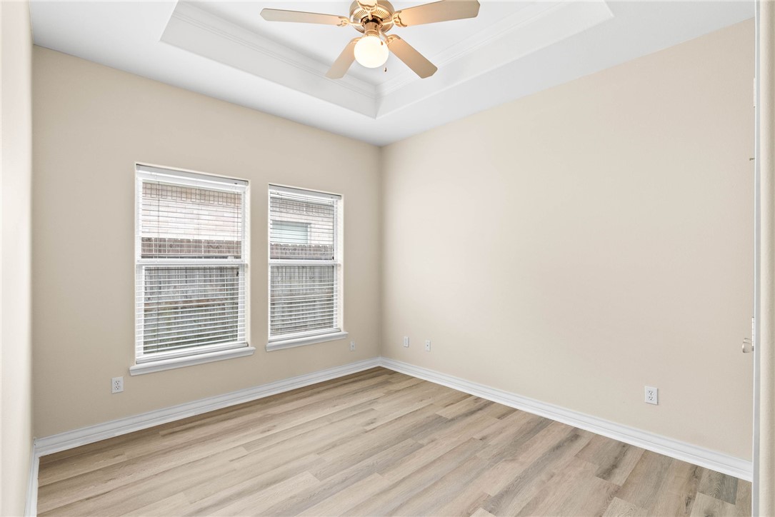 8205 Tango Circle Corpus Christi, TX 78414 - Photo 15 of 22 an empty room with a window and a ceiling fan