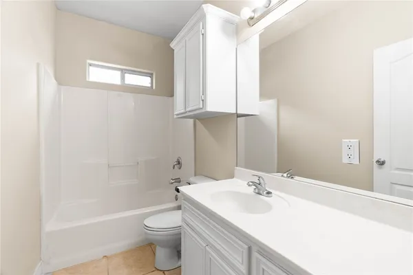 a bathroom with a sink a toilet and tub