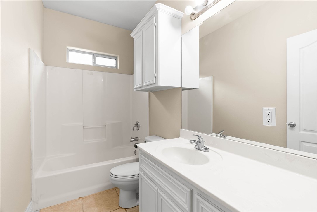 8205 Tango Circle Corpus Christi, TX 78414 - Photo 18 of 22 a bathroom with a sink a toilet and tub