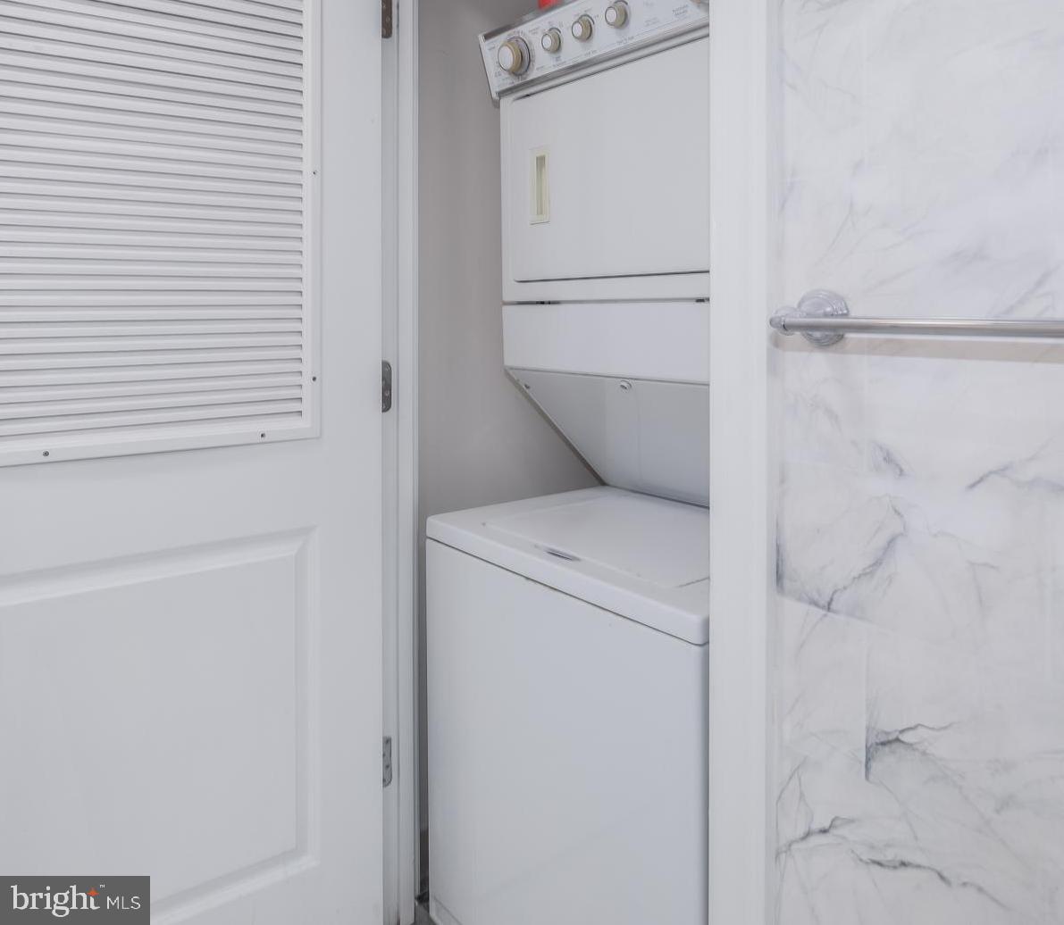 2425 L Street Northwest, Unit 211 Washington, DC 20037 - Photo 23 of 43 a utility room with dryer and washer