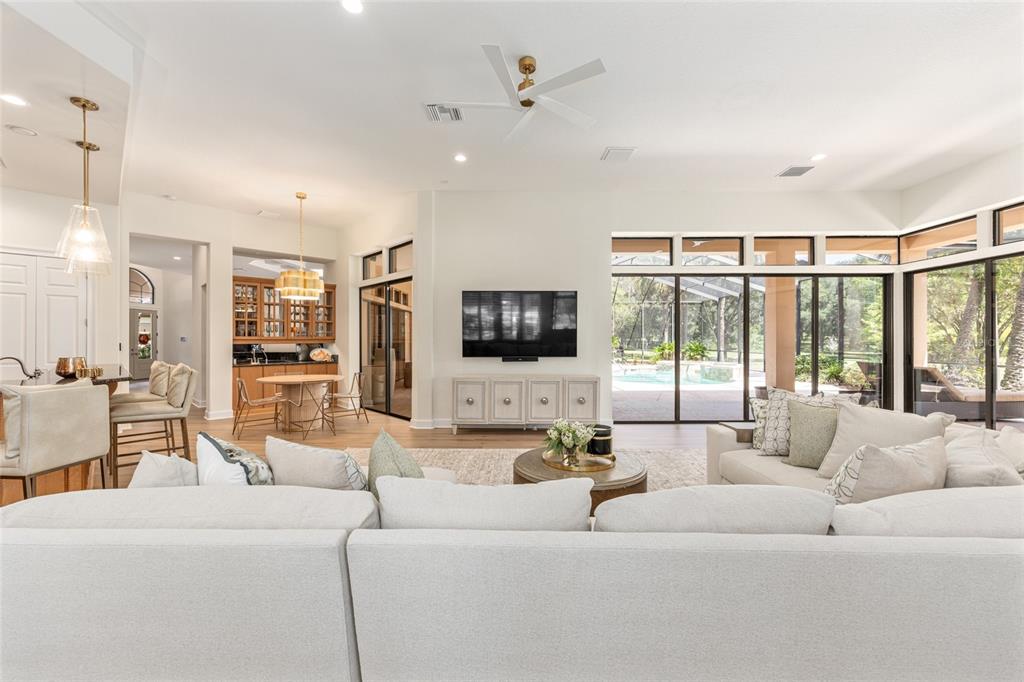 708 Southeast 44th Road Ocala, FL 34480 - Photo 17 of 76 a living room with furniture large window and a flat screen tv