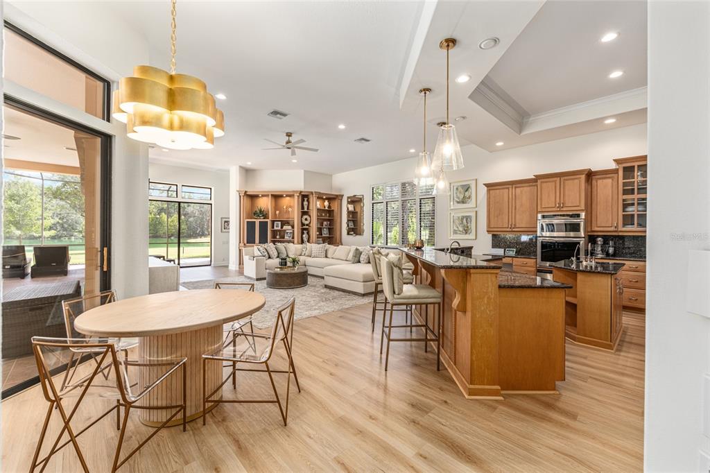 708 Southeast 44th Road Ocala, FL 34480 - Photo 26 of 76 a view of a dining room with furniture window and wooden floor